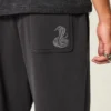 Calças de fato de treino largas com padrão de cobra