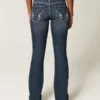 Calças de ganga bootcut com cintura baixa, lavagem escura e bordados