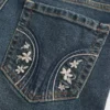 Calças de ganga bootcut com cintura baixa, lavagem escura e bordados