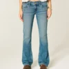 Calças de ganga bootcut de cintura baixa com lavagem média e tachas