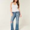 Calças de ganga bootcut de cintura baixa, rasgadas e lavagem média