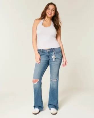 Calças de ganga bootcut de cintura baixa, rasgadas e lavagem média