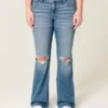 Calças de ganga bootcut de cintura baixa, rasgadas e lavagem média
