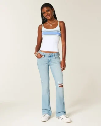 Calças de ganga bootcut rasgadas, de cintura baixa, com lavagem clara e bordados
