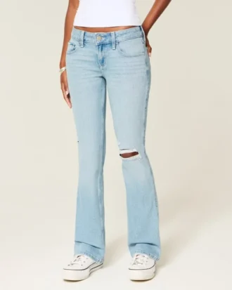 Calças de ganga bootcut rasgadas, de cintura baixa, com lavagem clara e bordados