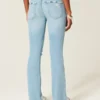 Calças de ganga bootcut rasgadas, de cintura baixa, com lavagem clara e bordados