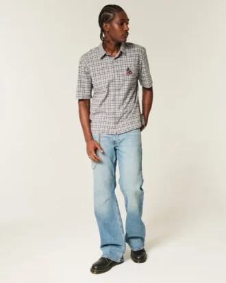 Calças de ganga bootcut relaxadas com lavagem média