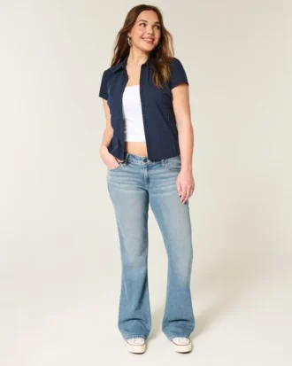 Calças de ganga de cintura baixa com lavagem média e corte bootcut