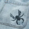 Calças de ganga largas com bordado Spider