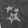 Calças de ganga largas com estampado Black Star lavadas