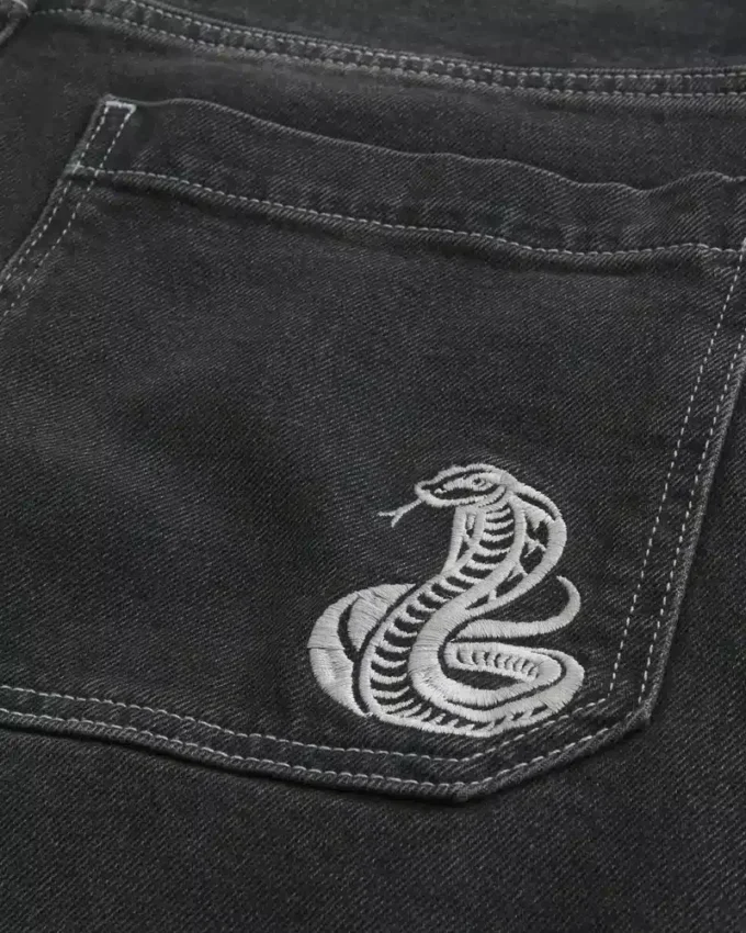 Calças de ganga largas com padrão de cobra preta lavada
