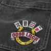 Calças de ganga largas skater pretas lavadas com bordado Good Luck