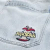 Calças de ganga super largas com estampado New York em lavagem clara