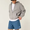 Calções de futebol largos até ao meio da coxa