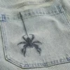 Calções de ganga super largos com bordado de aranha