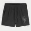 Calções desportivos com estampado até meio da coxa