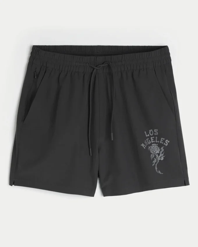Calções desportivos com estampado até meio da coxa