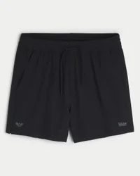 Calções desportivos com logótipo até meio da coxa