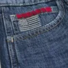 Calções largos de cintura baixa com estampado da bandeira americana em lavagem escura Calções largos de cintura baixa com estampado da bandeira americana em lavagem escura