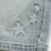 Calções largos de ganga com estrelas bordadas