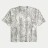 Camiseta boxy pesada com estampa camuflada