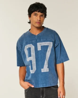 Camiseta de futebol americano com estampa gráfica, estilo universitário, folgada e pesada