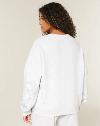 Camisola com estampa gráfica e tachas