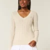 Camisola com gola em V e malha trançada