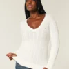 Camisola com gola em V e malha trançada