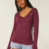 Camisola com gola em V e malha trançada