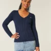 Camisola com gola em V e malha trançada