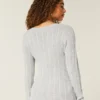 Camisola com gola em V e malha trançada
