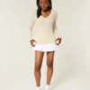Camisola com gola em V e malha trançada