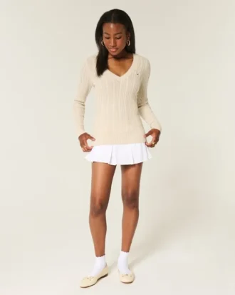 Camisola com gola em V e malha trançada