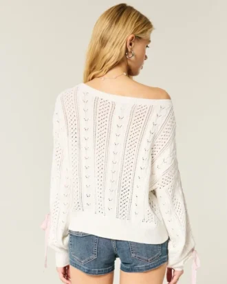 Camisola com mangas com laços e padrão trançado