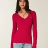 Camisola icónica com gola em V e malha trançada