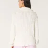 Camisola oversized com malha trançada e meio fecho