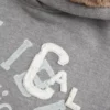 Capuz com forro de pele sintética Capuz com estampado