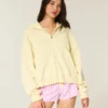 Casaco com capuz e fecho com estampa de estrela do mar oversized