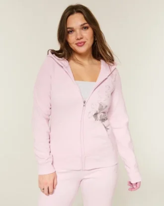 Casaco com capuz e fecho com estampado de rosas