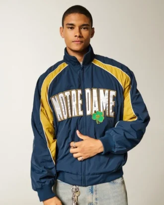 Casaco corta-vento com gráfico Fighting Irish da Universidade de Notre Dame