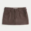Mini-saia-calça de cintura baixa em camurça sintética Mini-saia-calça de cintura baixa em camurça sintética