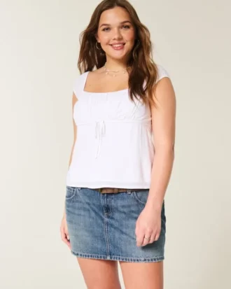Mini-saia-calça de ganga bordada de cintura baixa