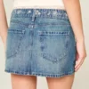 Mini-saia-calça de ganga bordada de cintura baixa