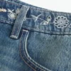 Mini-saia-calça de ganga bordada de cintura baixa