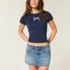 Mini-saia-calça de ganga com cintura baixa e laço bordado Mini-saia-calça de ganga com cintura baixa e laço bordado