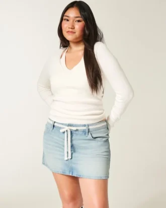 Mini-saia-calça de ganga com cintura baixa e laço de renda