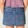 Mini-saia-calça de ganga com tachas e cintura baixa Mini-saia-calça de ganga com tachas e cintura baixa