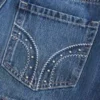 Mini-saia-calça de ganga com tachas e cintura baixa Mini-saia-calça de ganga com tachas e cintura baixa