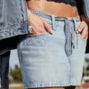 Mini-saia-calça de ganga de cintura baixa Classe de ’26